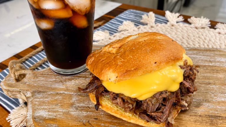 Shredded beef and cheddar sauce piled onto sandwich rolls.